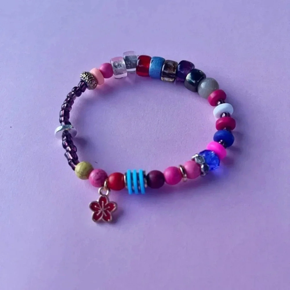 Handmade beaded statement bracelet with flower charm